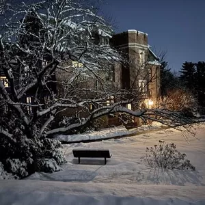 A lovely mid-February snow & glow from the east entrance of our Original Building.