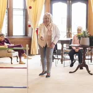 Still snowing in March? No problem, Residents enjoy lawn games indoors!